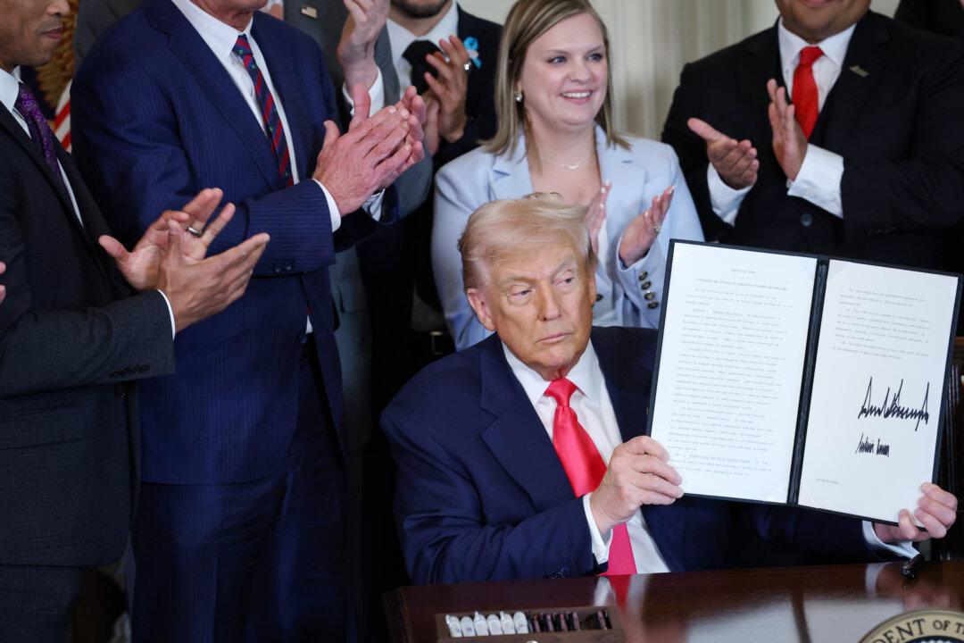 President Donald Trump signs an executive order in the East Room of the White House on Nov. 13, 2025. The Trump administration has made housing a top priority, with the president signing an executive order preventing large institutional investors from buying single-family homes. (Anna Moneymaker/Getty Images)