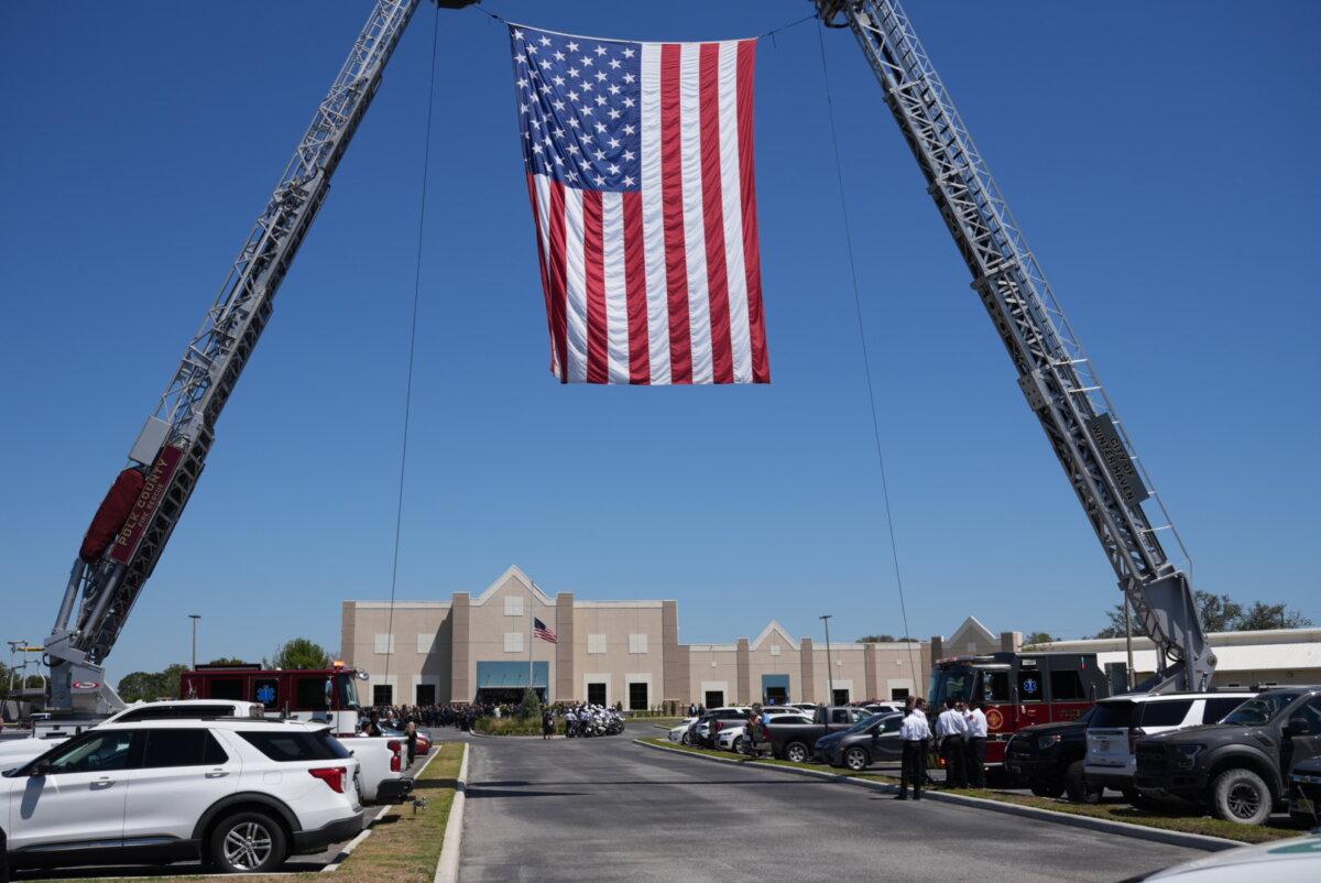 Hundreds of people gather outside the Haven Worship Center to send off the remains of Maj. Cody Khork, one of the soldiers killed in the Middle East. A memorial service was held for Khork in Winter Haven, Fla., on March 21, 2026. (Troy Myers/The Epoch Times)