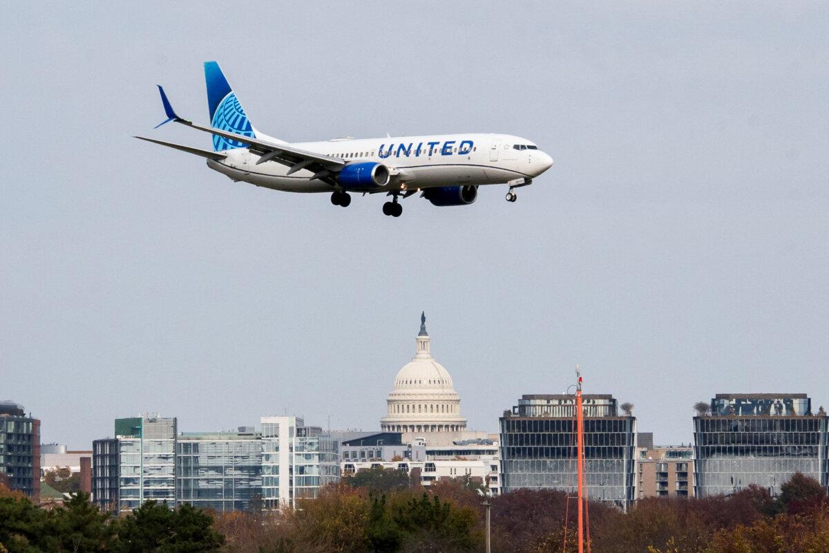 A United Airlines flight lands in front of the U.S. Capitol at Ronald Reagan Washington National Airport in Arlington, Va., on Nov. 7, 2025. (Nathan Howard/Reuters)
