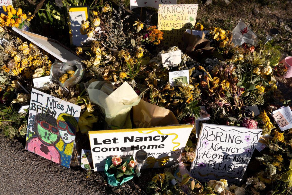 An ever-growing collection of yellow flowers and notes sit at the home of Nancy Guthrie, the missing mother of "Today" show host Savannah Guthrie, in Tucson, Ariz., on March 6, 2026. (Rebecca Noble/AP Photo)