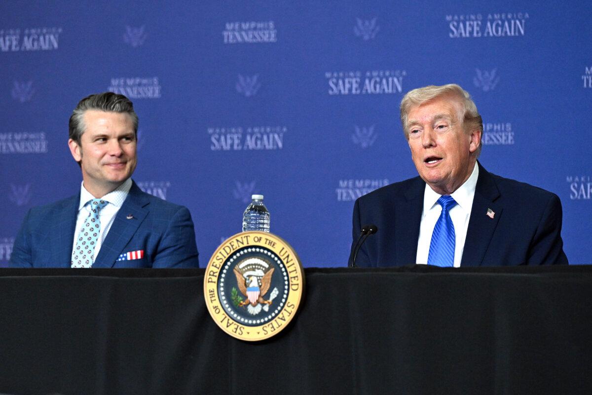 President Donald Trump (R), joined by Secretary of War Pete Hegseth (L), speaks during a Memphis Safe Task Force roundtable in Memphis on March 23, 2026. (Roberto Schmidt/Getty Images)