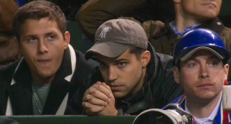Fans at a baseball game pray, in "Baseball: Beyond Belief." (Paulist Pictures)