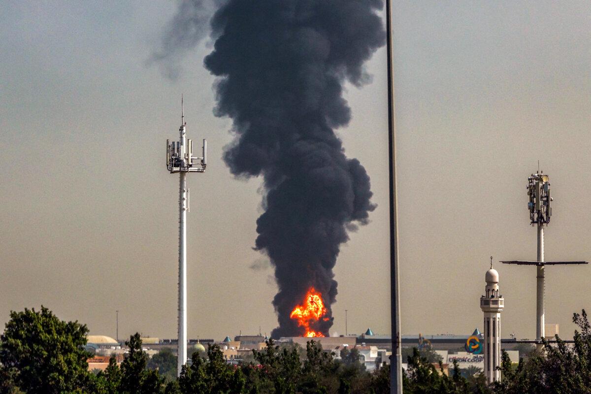 A smoke plume rises from a fire near Dubai International Airport in Dubai, United Arab Emirates, on March 16, 2026. (AFP via Getty Images)