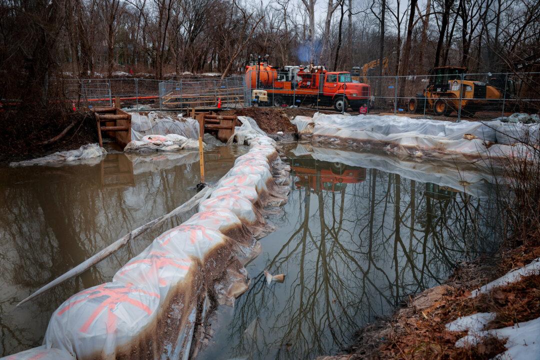 (Top Left) Pumps and pipes divert raw sewage into the C&O Canal and around a broken section of the Potomac Interceptor in Cabin John, Md., on Feb. 16, 2026. A section of the six-foot-wide sewage pipe collapsed on Jan. 19, causing more than 250 million gallons of raw sewage to be poured into the Potomac River. (Top Right) Workers look on at the C&O Canal around a broken section of the Potomac Interceptor in Cabin John, Md., on March 5, 2026. (Bottom Left) Water in the Potomac is seen in Cabin John, Md., on March 5, 2026. (Bottom Right) Earthen barriers near Lock 10 on the C&O Canal help redirect sewage back into the Potomac Interceptor in Cabin John, Md., on Feb. 16, 2026. (Chip Somodevilla, Heather Diehl/Getty Images)
