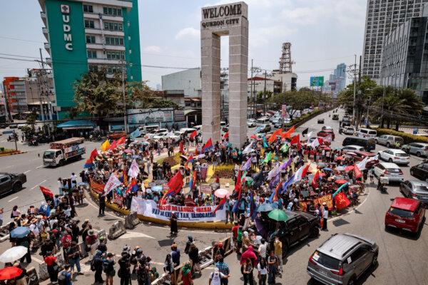 Day in Photos: Prime Minister Sworn-In in Nepal, Scotland Election Campaign, Strike Over Fuel Costs in the Philippines