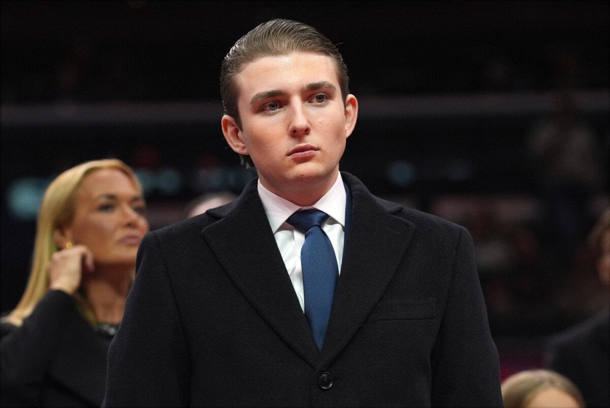 Barron Trump watches as his father, President Donald Trump attends an indoor Presidential Inauguration parade event at Capital One Arena in Washington on Jan. 20, 2025. (Evan Vucci/AP Photo)