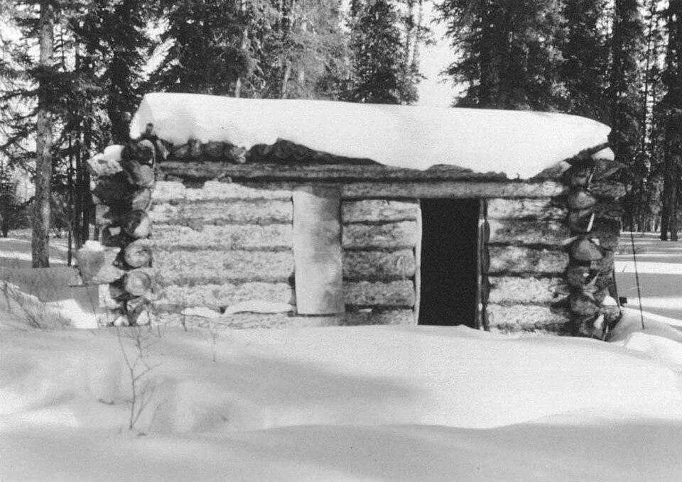 A cabin stands against the wilderness, symbolizing the darkness where Caswell's heroine tests the limits of human courage. (Public Domain)