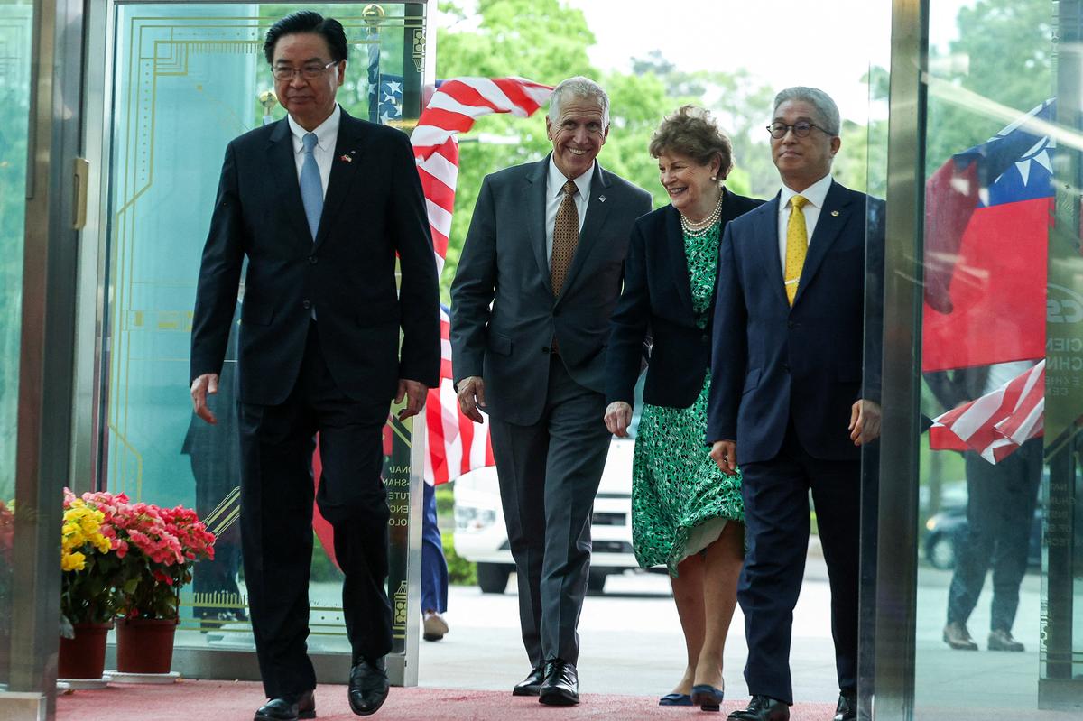 Taiwanese Secretary-General of the National Security Council Joseph Wu (L) and U.S. Sens. Thom Tillis (2nd L) and Jeanne Shaheen (3rd L) arrive at the National Chung-Shan Institute of Science and Technology (NCSIST) in Taoyuan, Taiwan, on March 30, 2026. (I-Hwa Cheng/AFP via Getty Images)