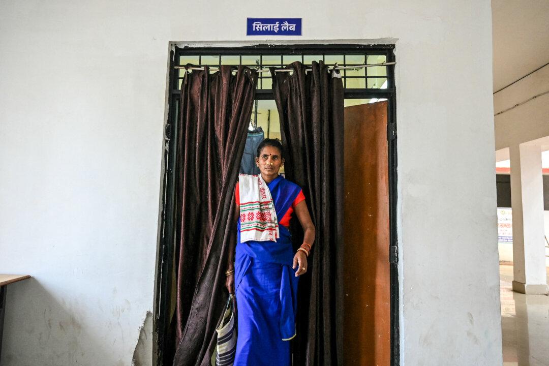 A former Maoist insurgent walks out of a stitching lab at Dantewada district's rehabilitation centre for surrendered Maoists, in Chhattisgarh's Bastar division, India, on March 30, 2026. India declared the country free of the Maoist insurgency, fulfilling a long-standing deadline to defeat the decades-long rebellion. Home Minister Amit Shah told parliament that India was "free" of the rebels, known as Naxals. (Shammi Mehra / AFP via Getty Images)