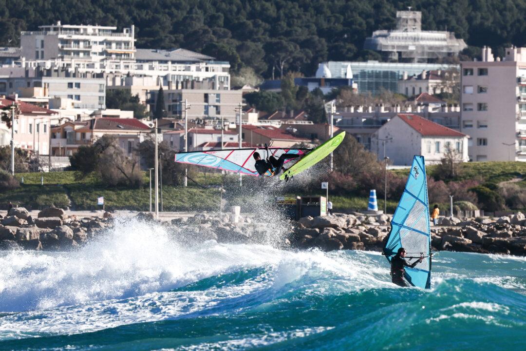 A windsurfer jumps over the waves during a strong mistral wind in Marseille, south-eastern France, on March 30, 2026. (Thibaud Moritz / AFP via Getty Images)