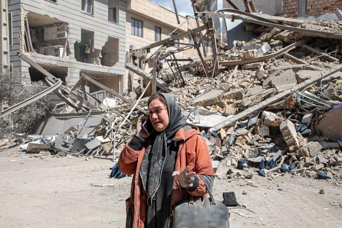 A resident near a residential building that was hit in an airstrike in Tehran, Iran, on March 30, 2026. (Majid Saeedi/Getty Images)