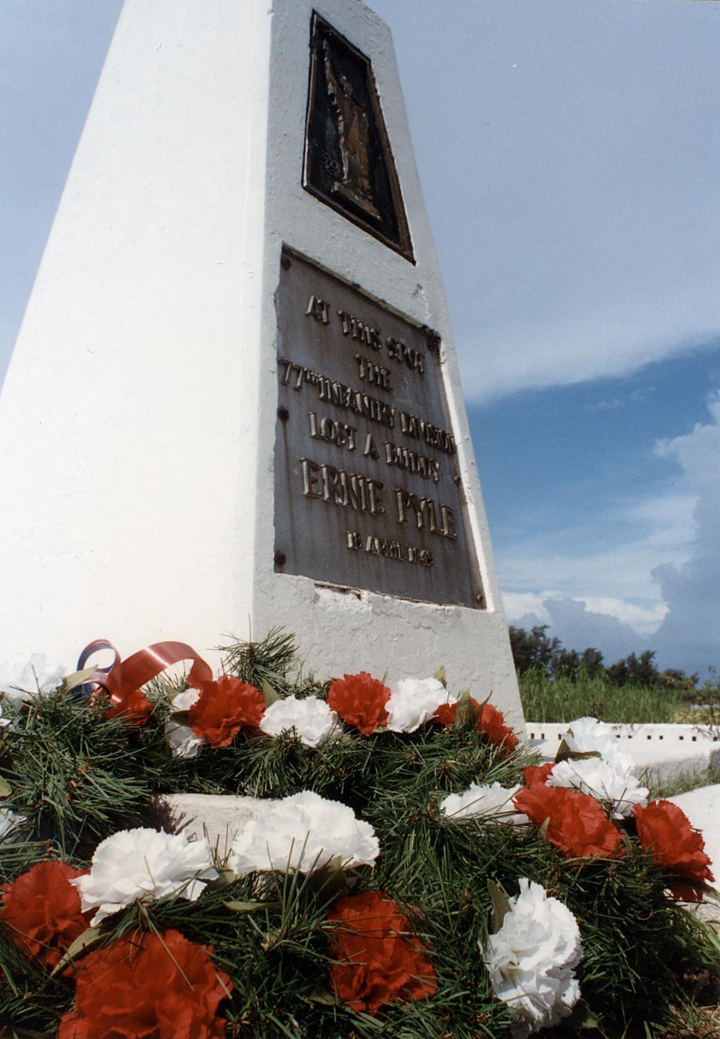 The Ernie Pyle Memorial on Iejima, Japan. The plaque reads: At this spot the 77th Infantry Division lost a buddy Ernie Pyle 18 April, 1945. (Public Domain)