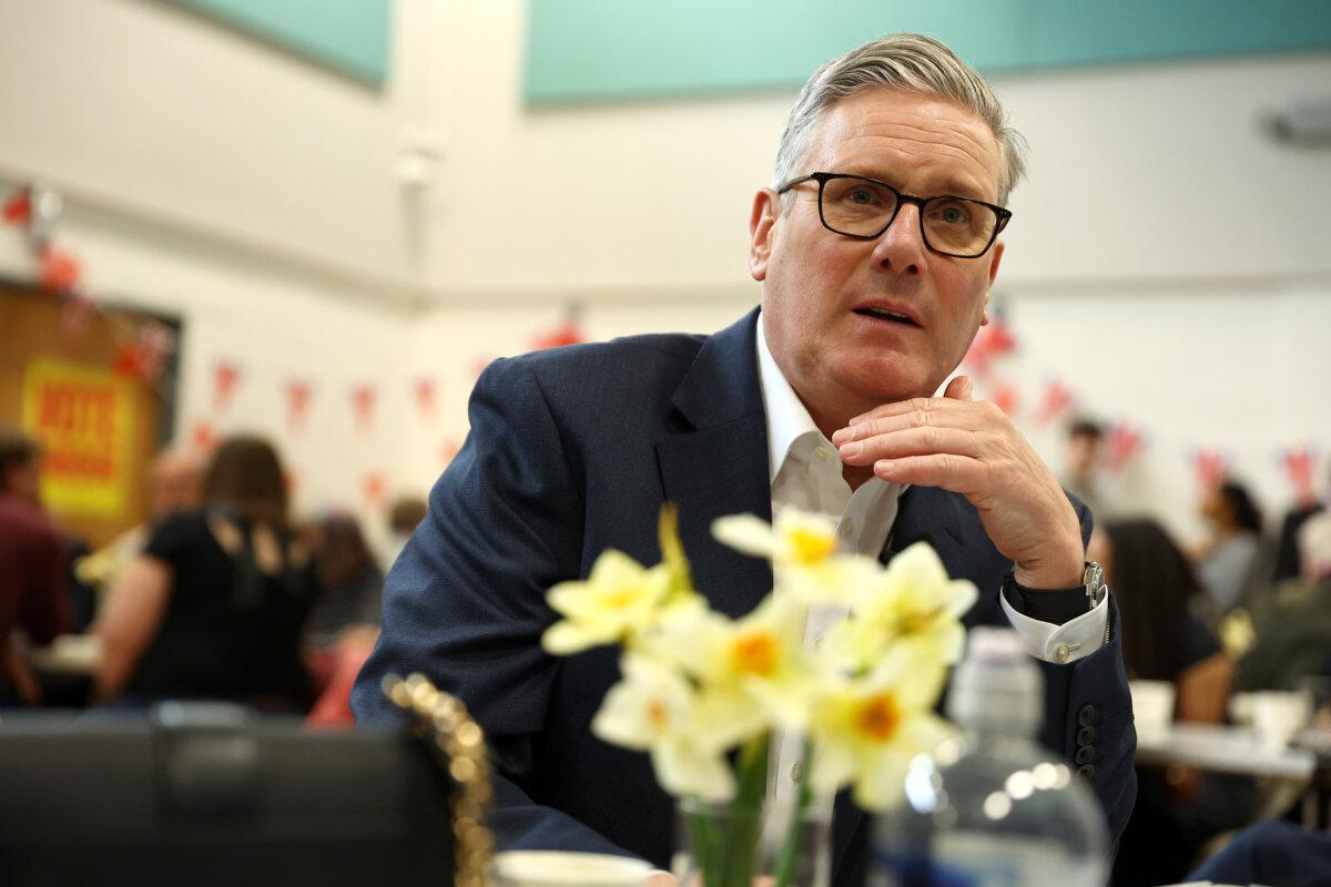 British Prime Minister Keir Starmer speaks with residents at Newton Leys pavilion in Milton Keynes, England, on April 1, 2026. (Peter Nicholls/Getty Images)