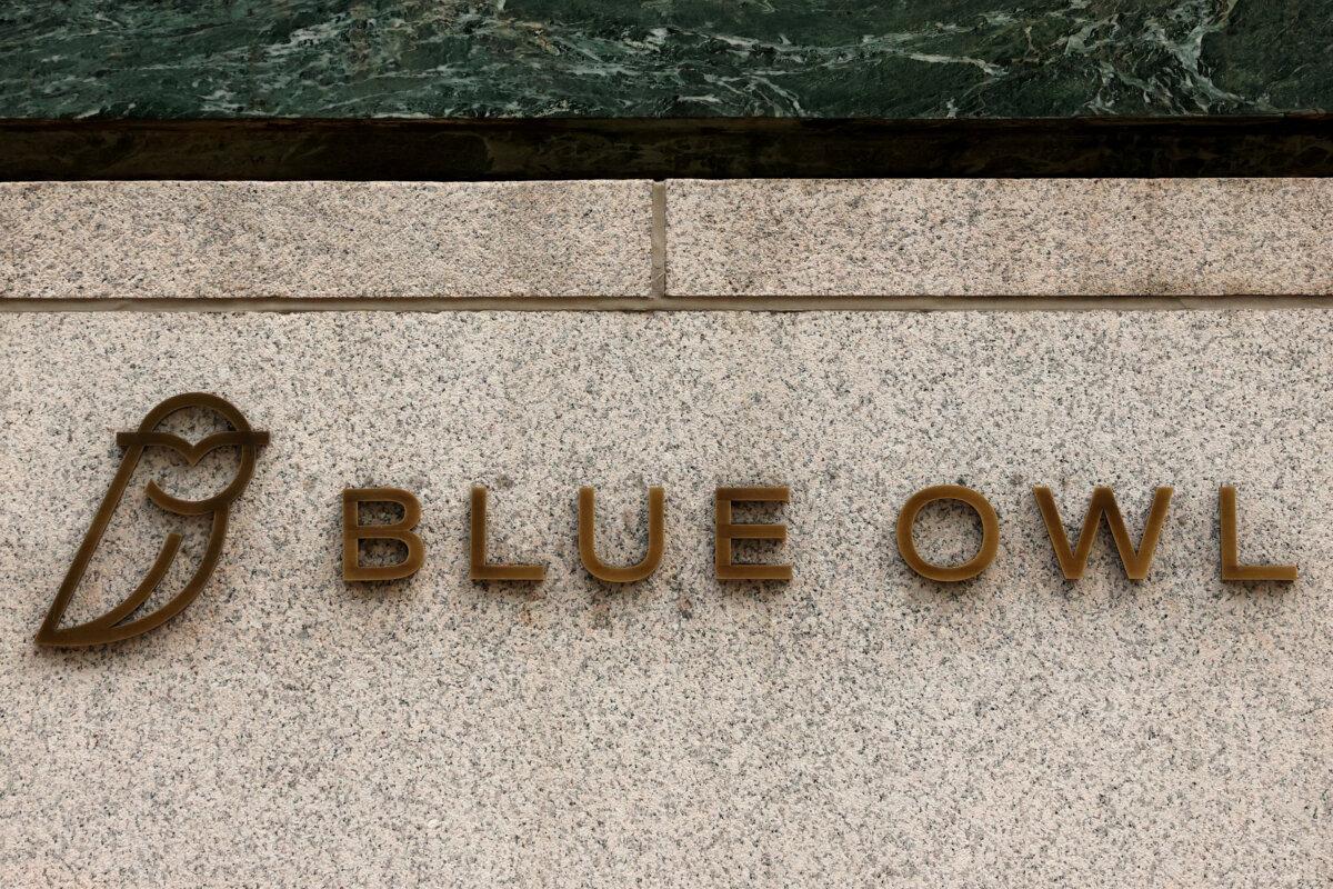 A logo for Blue Owl Capital is displayed on a midtown Manhattan office building in New York City on Feb. 24, 2026. (Brendan McDermid/Reuters)