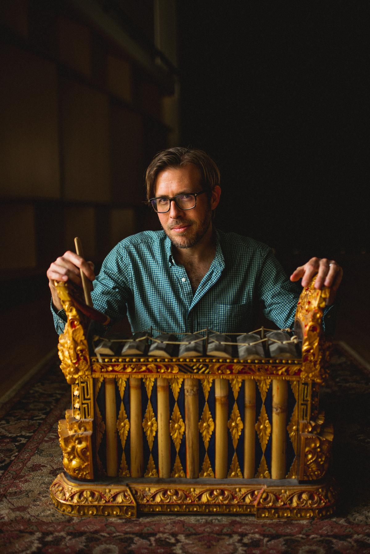Composer Chris Thomas is pictured playing a traditional Balinese gamelan. (Bradley Lanphear)