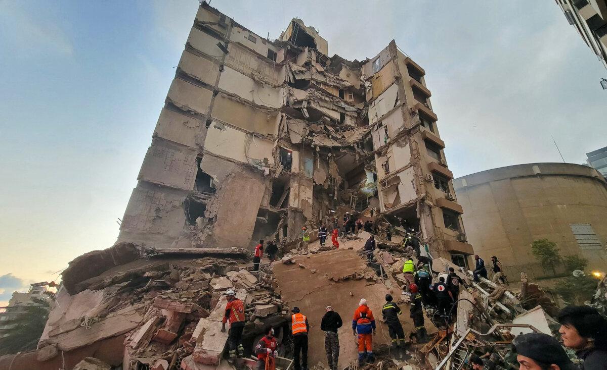 First responders and residents gather at the site of an Israeli airstrike in Beirut's Tallet al-Khayyat neighborhood, Lebanon, on April 8, 2026. (Fadel Itani/AFP via Getty Images)