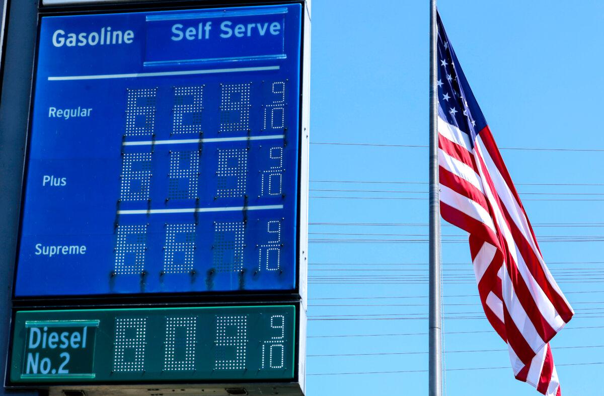 High gas prices are displayed at a Chevron gas station, with an American flag flying, in El Segundo, Calif., on April 8, 2026. (Mario Tama/Getty Images)