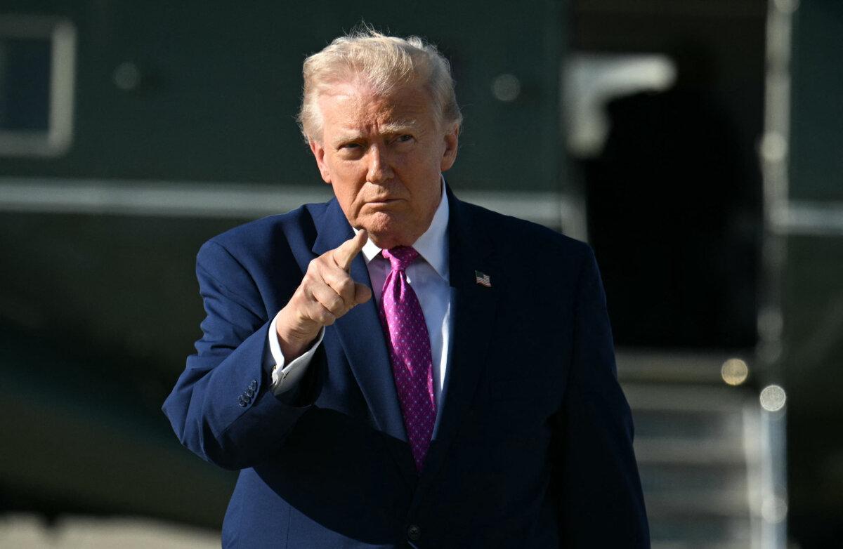 President Donald Trump gestures after stepping off Marine One at Joint Base Andrews, Md., on April 10, 2026. (Jim Watson/AFP via Getty Images)
