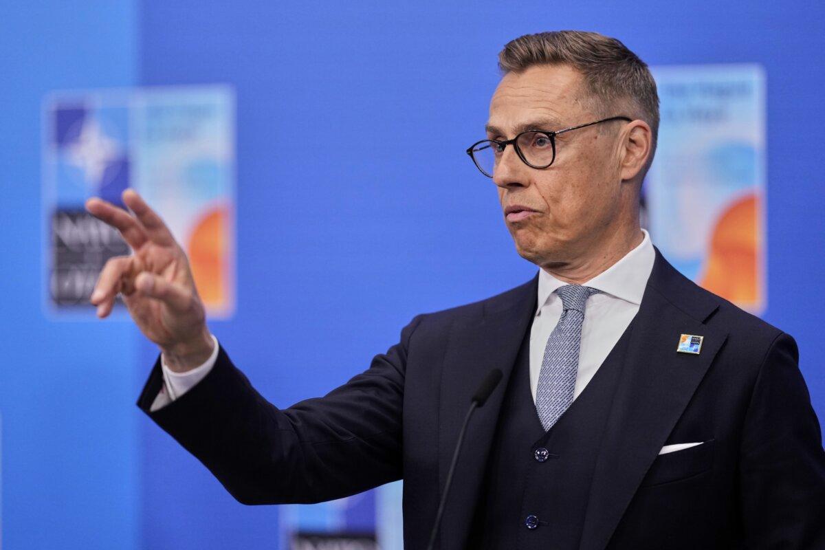 Finnish President Alexander Stubb speaks with the media as he arrives for the NATO summit in The Hague, Netherlands, on June 25, 2025. (Matthias Schrader/AP)