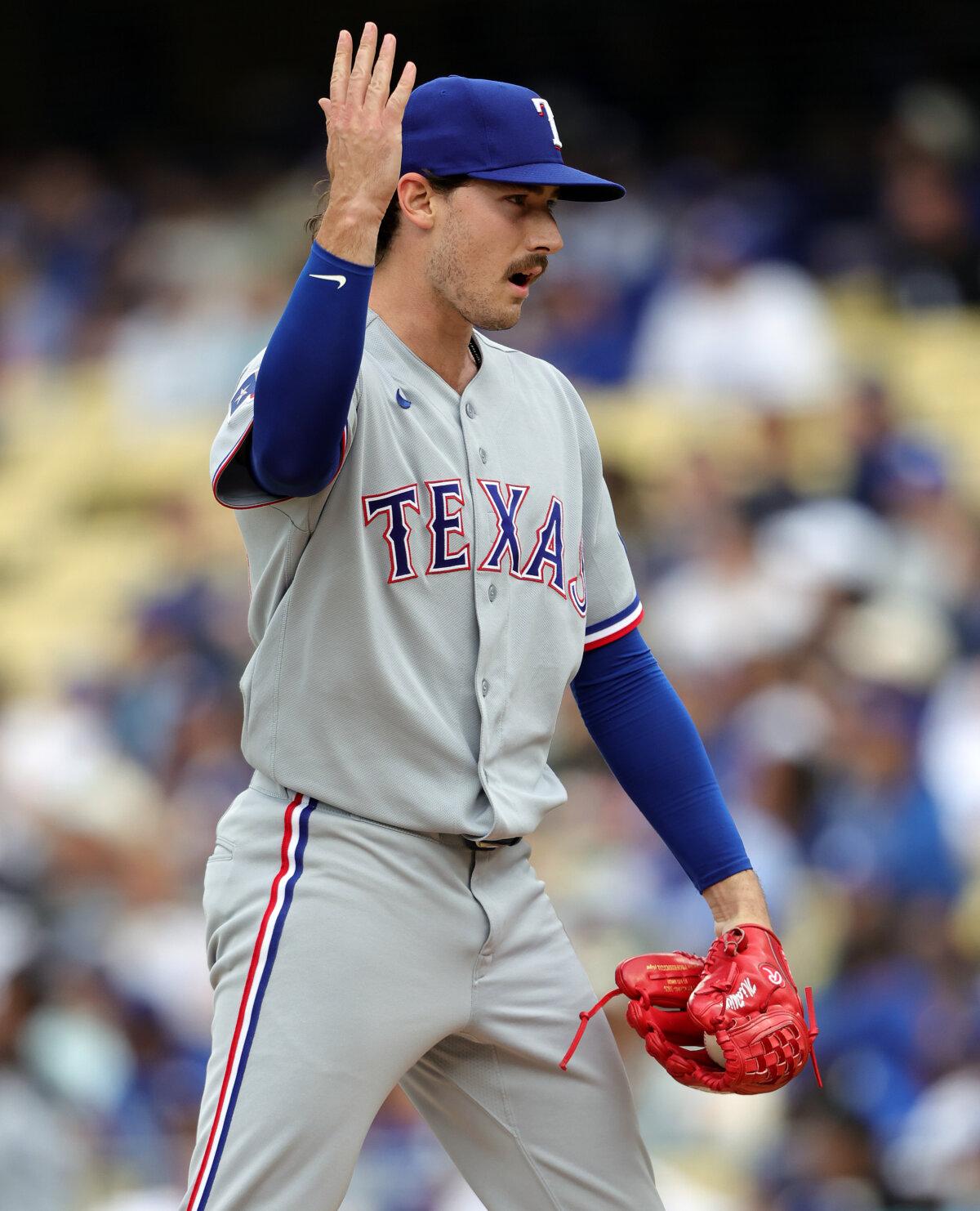 Cole Winn of the Texas Rangers reacts after winning a challenge against the Dodgers in the eighth inning at Dodger Stadium in Los Angeles on April 12, 2026. (Ronald Martinez/Getty Images)