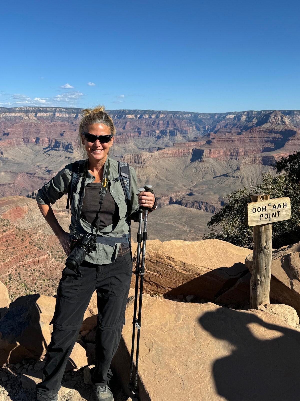 Unlike on her first visit to Grand Canyon National Park decades earlier, writer Lori Rackl smiles for the camera at Ooh Aah Point, a scenic stop on the South Kaibab Trail. (Courtesy of Lori Rackl/TNS)