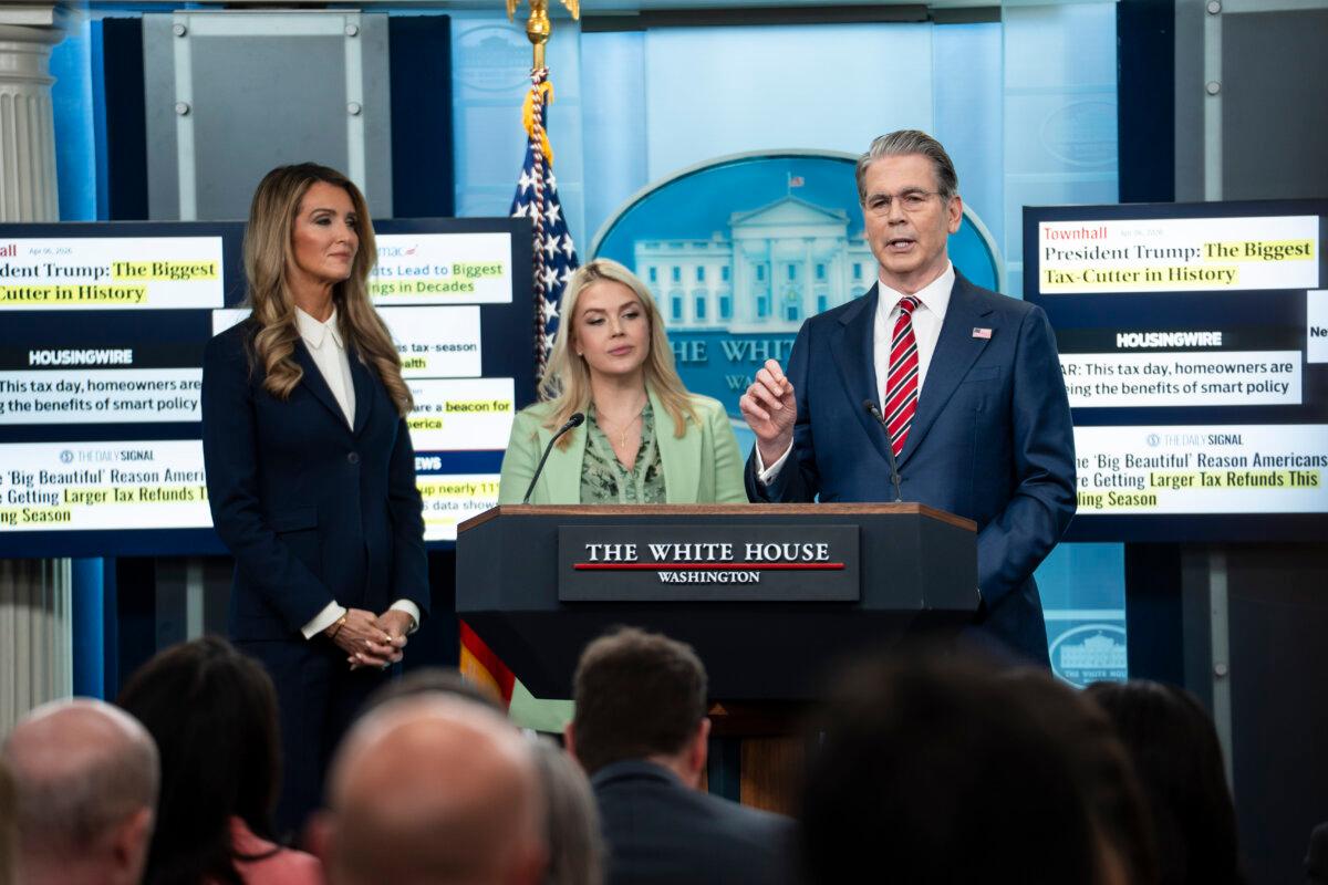 White House press secretary Karoline Leavitt, Administrator of the U.S. Small Business Administration Kelly Loeffler, and Treasury Secretary Scott Bessent speak during a news conference at the White House on April 15, 2026. (Madalina Kilroy/The Epoch Times)