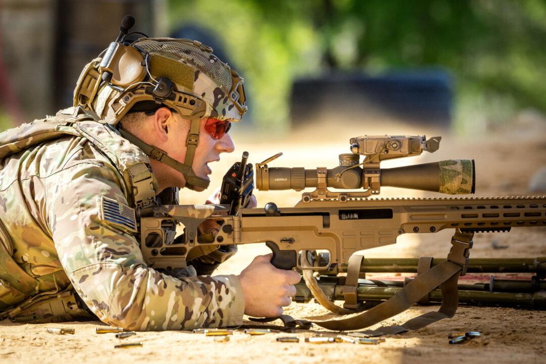 (Top, Bottom Right) Snipers with the U.S. Army perform shooting exercises at Fort Benning, Ga., on April 8, 2026. Unlike other competitions at Infantry Week, the International Sniper Competition was open not only to members of the Army but also to the Marine Corps, the Navy, and international competitors. (Bottom Left) Soldiers with the U.S. Army’s 10th Mountain Division perform shooting exercises at Fort Benning, Ga., on April 8, 2026. (John Fredricks/The Epoch Times)