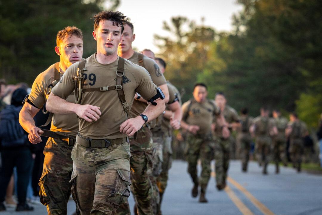 Soldiers compete in the Best Ranger Competition at Fort Benning, Ga., on April 10, 2026. Throughout the course of the three-day event, competitors traversed at least 60 miles on foot, each carrying around 80 pounds of gear, all while consuming few calories and getting little chance to sleep. (John Fredricks/The Epoch Times)