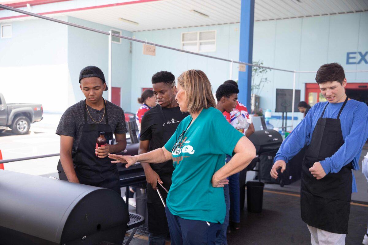 The chef mentors young cooks at a World Junior BBQ League event in the Grand Cayman in 2023. (Courtesy of Melissa Cookston)