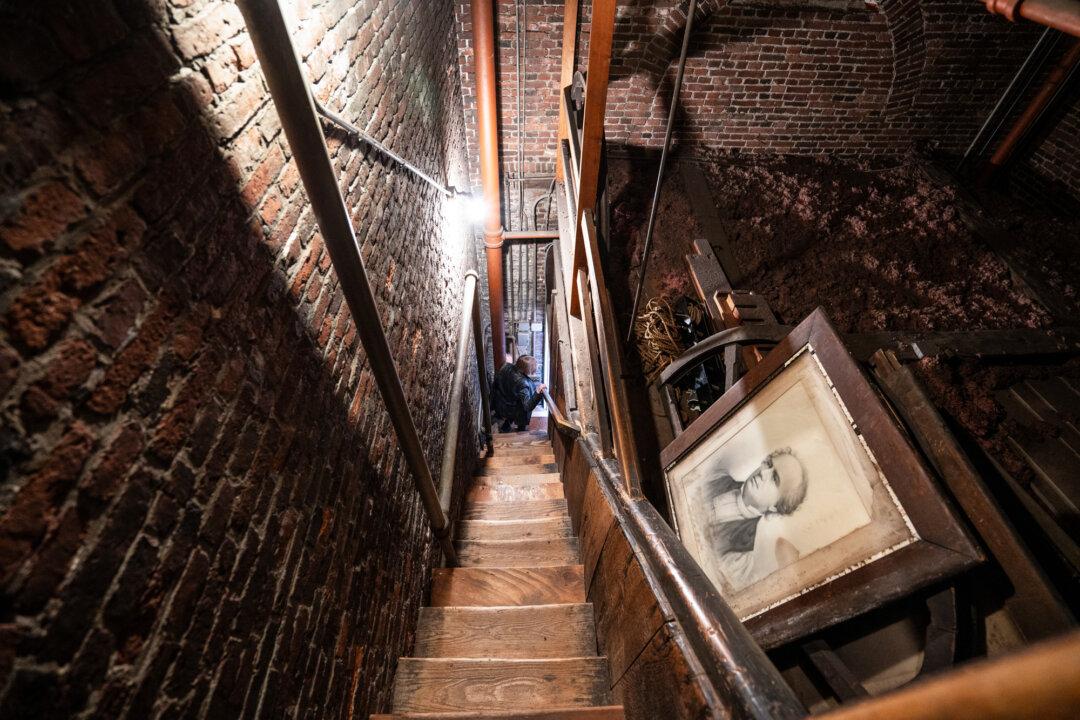 (Top Left) A replica of the 1792 contract Paul Revere signed to serve as a bell ringer at the Old North Church is displayed in Boston on April 8, 2026. (Top Right) A bust of George Washington is displayed inside the Old North Church in Boston on April 8, 2026. (Bottom Left) Photos on display in Boston on April 8, 2026, show the church’s steeple collapse during Hurricane Carol on Aug. 31, 1954. (Bottom R) Old North Church in Boston on April 8, 2026. (Samira Bouaou/The Epoch Times)