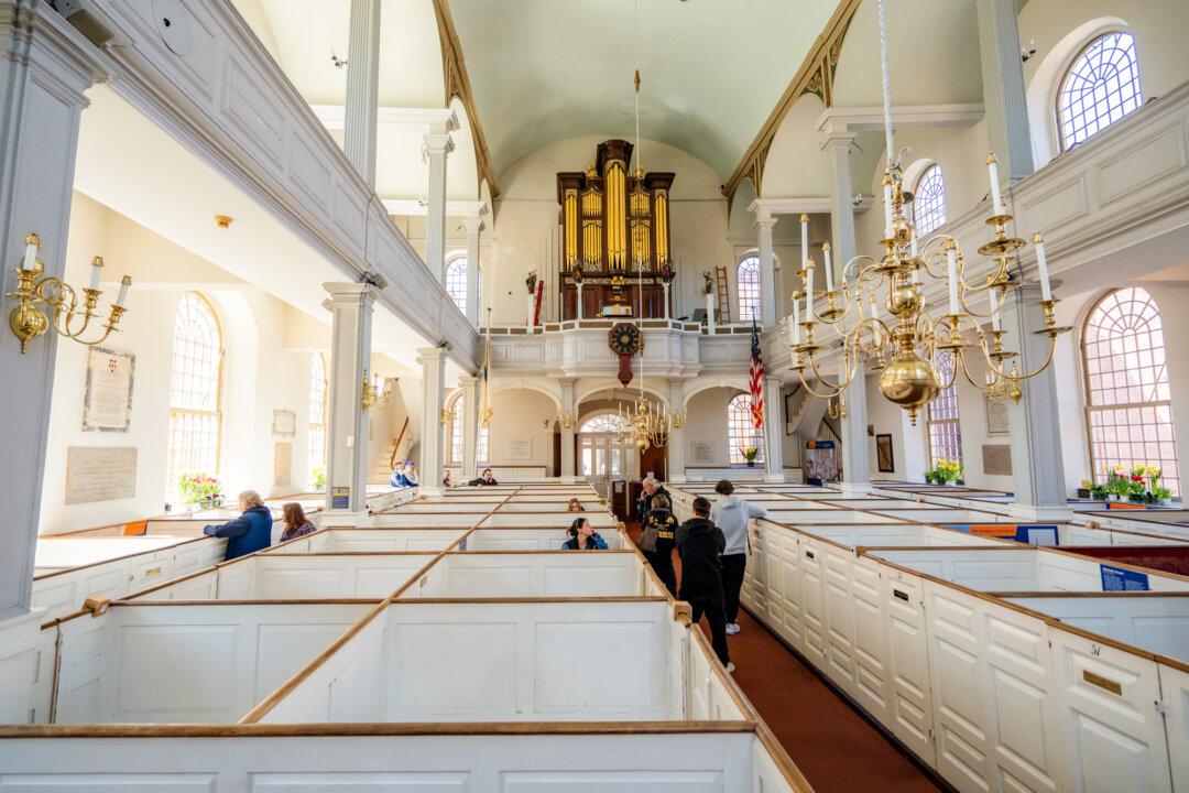 (Top) Charles White, a young Army veteran and history buff, at the Old North Church in Boston on April 8, 2026. (Bottom) Old North Church in Boston on April 8, 2026. (Samira Bouaou/The Epoch Times)