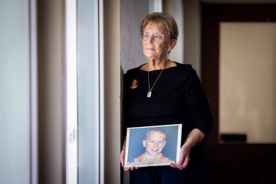 Judy Rogg holds a photo of her late son Erik in Los Angeles on April 15, 2026. Erik died in 2010 after attempting a “choking game” challenge, in which participants seek a brief high by cutting off oxygen until they pass out. (John Fredricks/The Epoch Times)