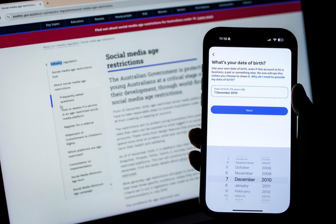 In this photo illustration, the Instagram account creation page is displayed on a phone in Sydney on Dec. 7, 2025. Both YouTube and TikTok have introduced progressive age verification mechanisms in recent years—but neither currently requires all users to verify their age with identification or biometric assessment to open an account. (George Chan/Getty Images)