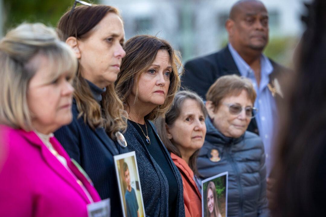 Survivor parents listen as an attorney speaks to the press during a landmark social media addiction trial outside Los Angeles Superior Court in Los Angeles on Feb. 18, 2026. (Jill Connelly/Getty Images)