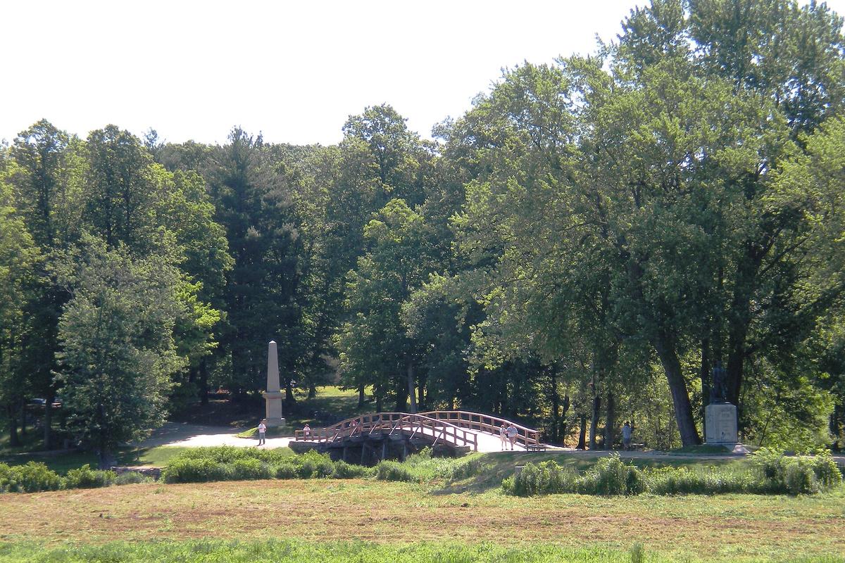 The Old North Bridge and the Obelisk Monument, which memorializes the site of the American Revolution's beginning. (Public Domain)