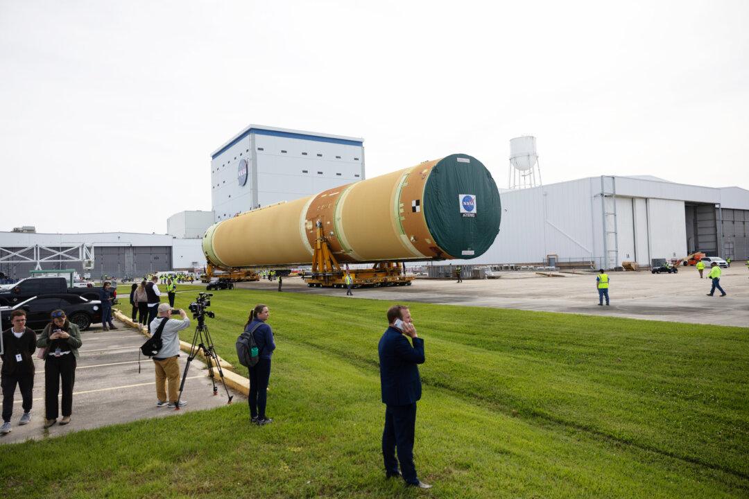 NEW ORLEANS, LOUISIANA - APRIL 20: NASA rolls out the top four-fifths of the SLS core stage for the Artemis III mission from Michoud Assembly Facility on April 20, 2026 in New Orleans, Louisiana. It will be loaded onto the Pegasus barge for delivery to Kennedy Space Center in Florida. Once there, teams will complete final outfitting and integration, with the four RS-25 engines scheduled to arrive from Stennis Space Center by July 2026. Artemis III, the second crewed Artemis mission following the successful Artemis II lunar flyby is targeting a 2027 launch to test rendezvous and docking capabilities ahead of landing American astronauts on the Moon in 2028. (Photo by Kathleen Flynn/Getty Images)