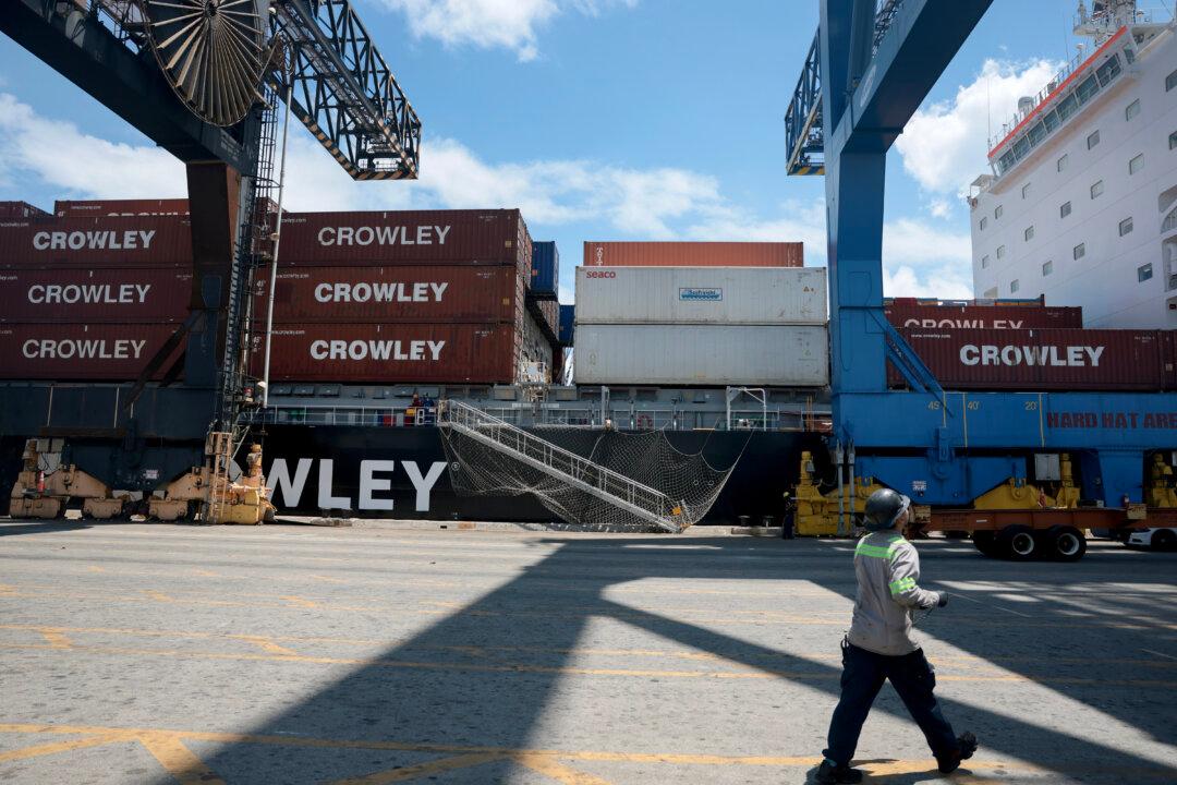 FORT LAUDERDALE, FLORIDA - APRIL 20: Dock workers offload shipping containers from a ship at Port Everglades on April 20, 2026 in Fort Lauderdale, Florida. The U.S. government has launched an online portal for companies to claim refunds for tariffs invalidated by the Supreme Court earlier this year. In a 6-3 decision, the Court ruled that President Donald Trump overstepped Congress’s tax-setting authority by imposing new import tax rates on products from nearly every country, citing the U.S. trade deficit as a national emergency. More than 300,000 American importers are reportedly owed about $166 billion in refunds plus interest. (Photo by Joe Raedle/Getty Images)