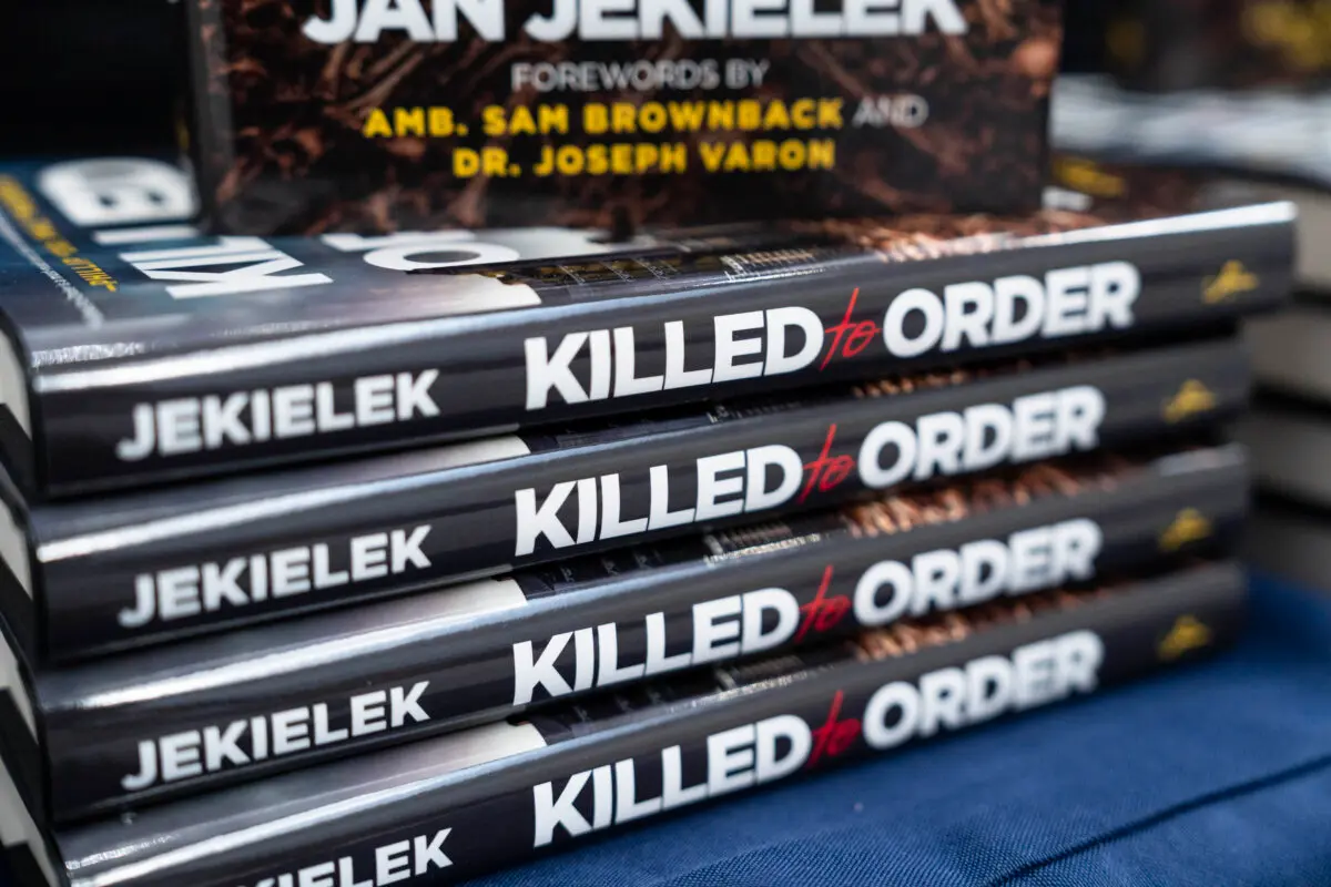 Jan Jekielek, Epoch Times senior editor and author of "Killed to Order,” receives the French Quarter Magazine 2026 Best Author of the Year award at the French Embassy in Washington on April 20, 2026. (Madalina Kilroy/The Epoch Times)