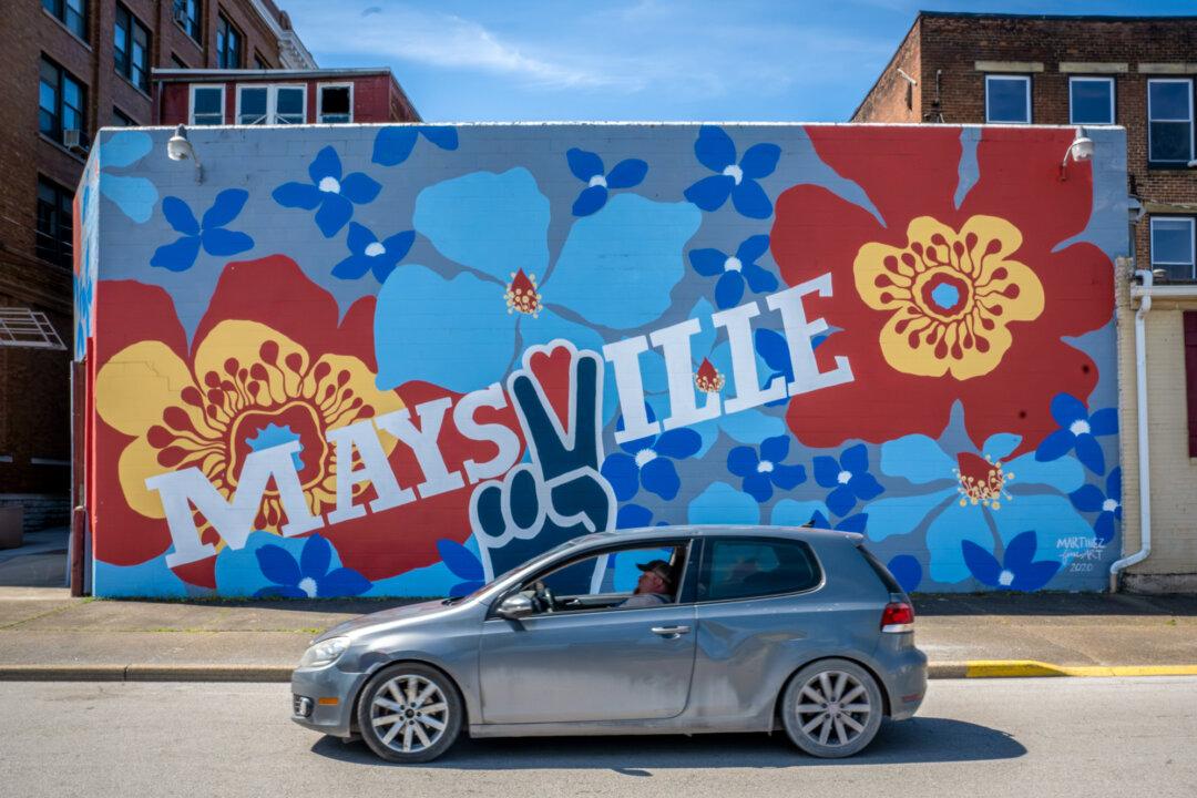 A motorist drives past a mural in Maysville Ky., on April 10, 2026. (Glenn Hartong for The Epoch Times)