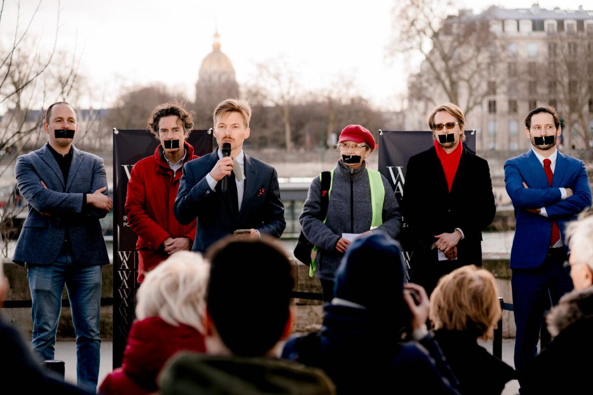 Nicolas Conquer (center), founder of Western Arc, speaks at a Paris protest following French prosecutors' raid on X's headquarters. (Lauren Kim-Minn/Courtesy of Western Arc)