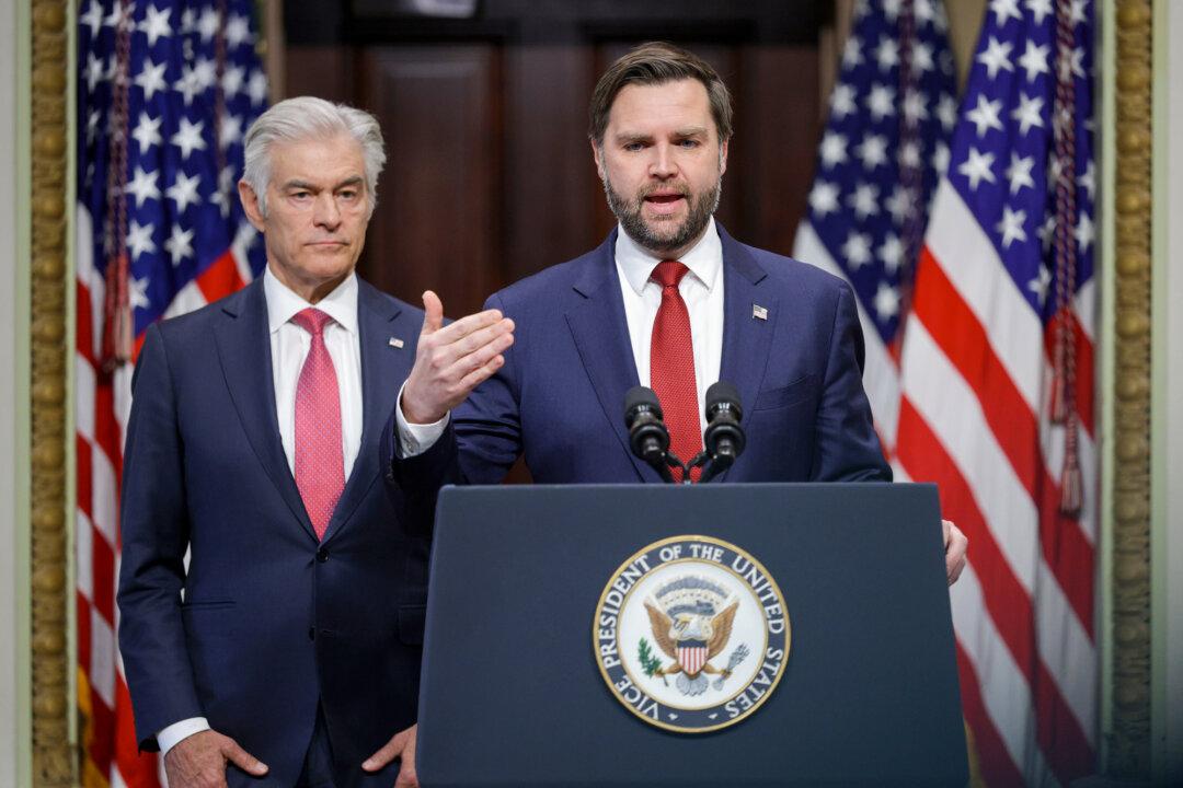 Vice President JD Vance speaks as Administrator for the Centers for Medicare and Medicaid Services Mehmet Oz listens during an announcement at the Eisenhower Executive Office Building of the White House on Feb. 25, 2026. Vance announced that some Medicaid funding to the state of Minnesota would be temporarily halted over fraud concerns. (Alex Wong/Getty Images)