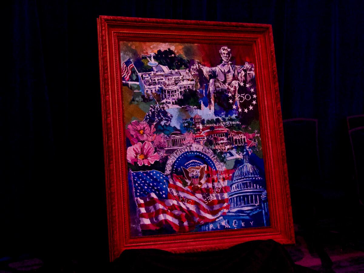 The Congressional Club gifted First Lady Melania Trump with an original painting by Steve Penley during the 113th First Lady's Luncheon at the Washington Hilton in Washington on April 23, 2026. (Travis Gillmore/The Epoch Times)