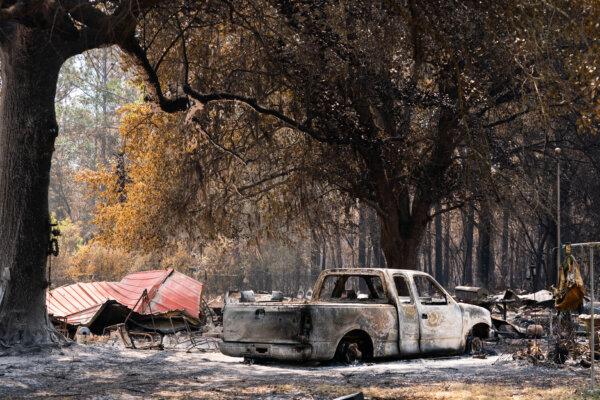 A burned out vehicle consumed by the Brantley Highway 82 wildfire in Atkinson, Ga., on April 23, 2026. The wildfire is one of many burning in the southeastern United States. (Sean Rayford/Getty Images)