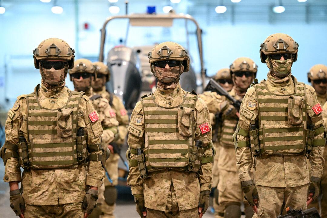 Turkish amphibious troops pose aboard a drone-capable assault ship during NATO’s Neptune Strike 2025-3 exercise in the Adriatic Sea on Sept. 24, 2025. Some analysts have questioned Spain and Turkey’s positioning, citing perceived alignment with Iran and members of the Shanghai Cooperation Organization bloc. (Alberto Pizzoli/AFP via Getty Images)