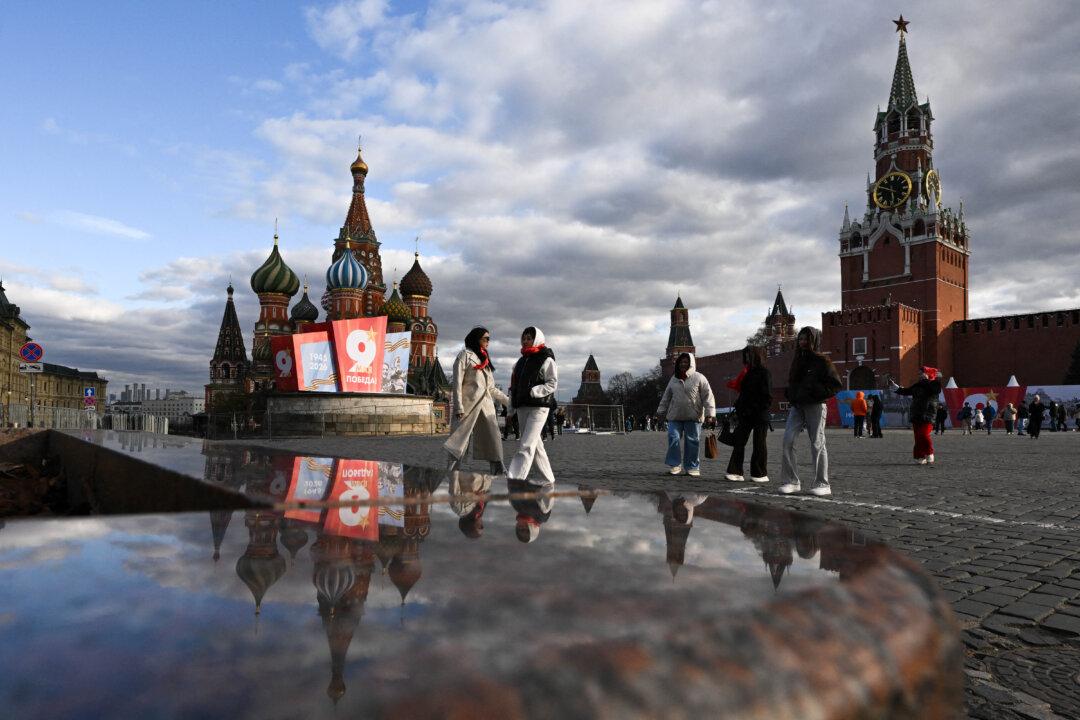 Tourists visit Red Square adorned with first Victory Day decorations in central Moscow on April 24, 2026. Russia will celebrate the 81st anniversary of the 1945 victory over Nazi Germany on May 9. (Photo by Igor IVANKO / AFP via Getty Images)
