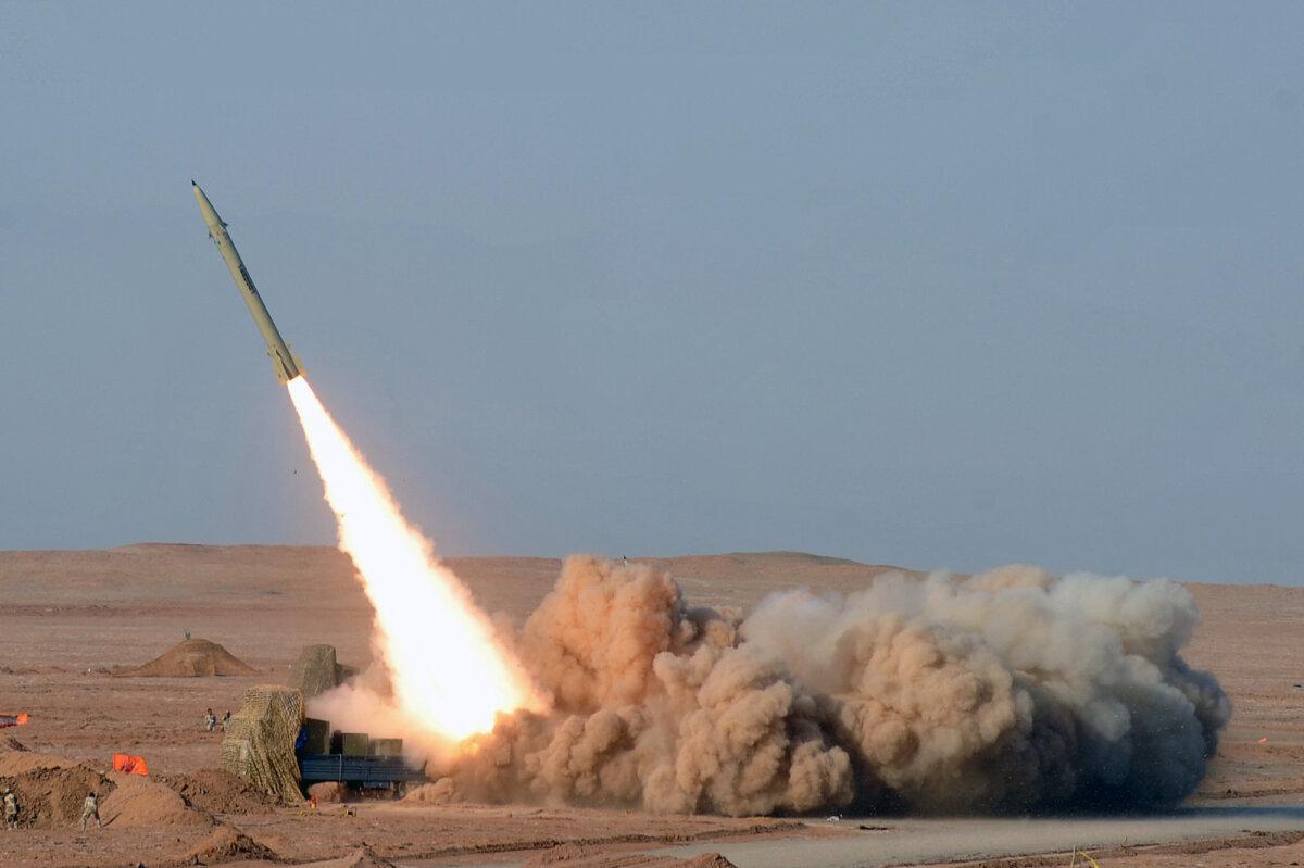 An Iranian short-range missile is launched during military exercises for Iran's Revolutionary Guards at an undisclosed location in Iran's Kavir Desert, in an image obtained on July 3, 2012. (Arash Khamoushi/Isna news agency/AFP via Getty Images)