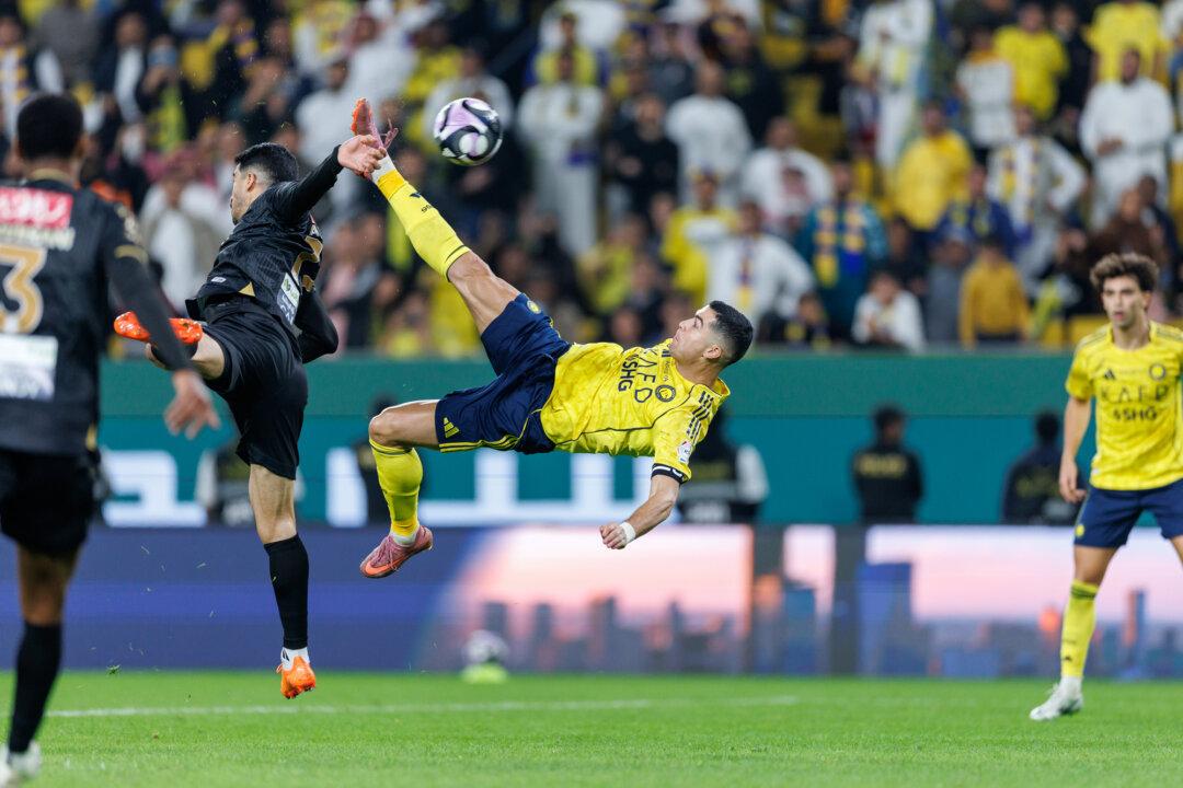 Cristiano Ronaldo of team Al-Nassr FC scores the team's fourth goal during the Saudi Pro League match between Al Nassr and Al Khaleej at Al Awwal Park in Riyadh, Saudi Arabia, on Nov. 23, 2025. (Abdullah Ahmed/Getty Images)