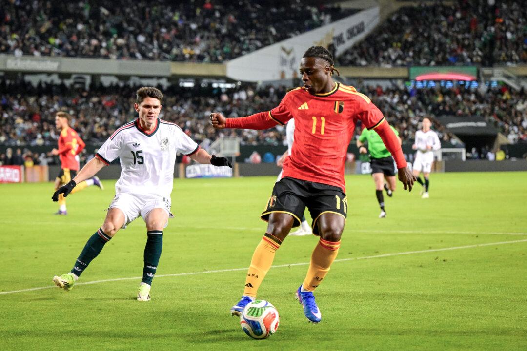 Mexico’s Israel Reyes and Belgium’s Jeremy Doku during a friendly soccer game between the Mexican national team and Belgian national soccer team, the Red Devils, in Chicago, on April 1, 2026, in preparation for the 2026 World Cup. (Dirk Waem / Belga Mag / Belga / AFP via Getty Images)