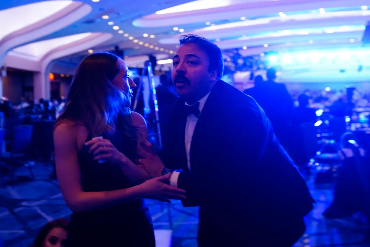 People take cover after an incident at the annual White House Correspondents Association Dinner at the Washington Hilton in Washington on April 25, 2026. (Nathan Howard/Getty Images)