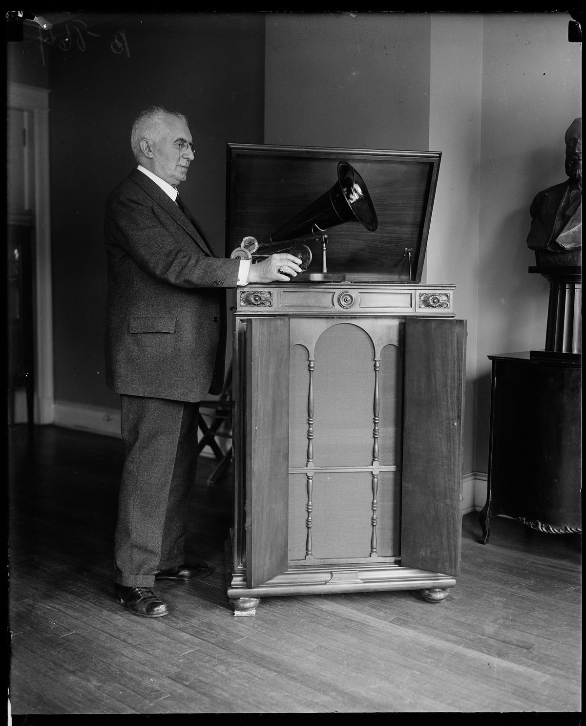 Emile Berliner with a Victor Victrola Credenza and with one of his early gramophones, 1927. Library of Congress. (Public Domain)
